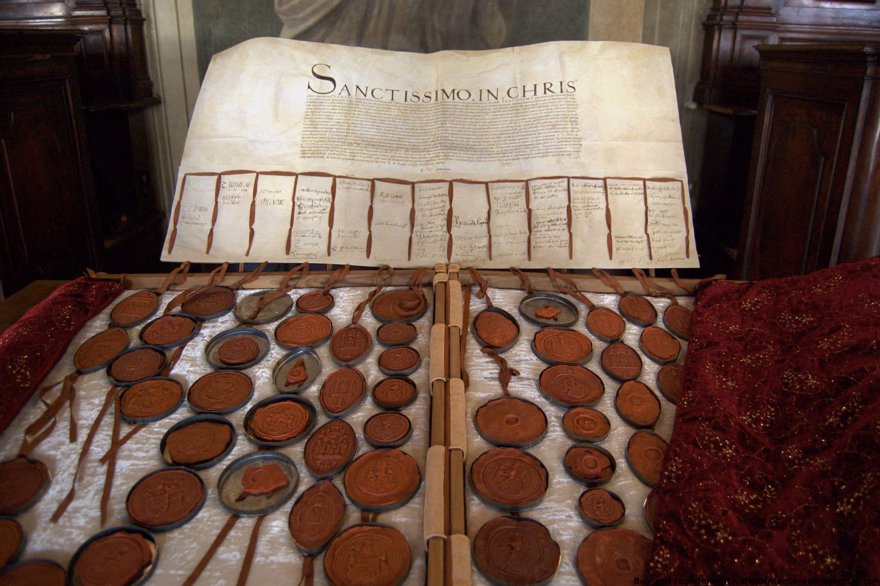 The Causa Anglica document lying open, with its long row of pendant seals.