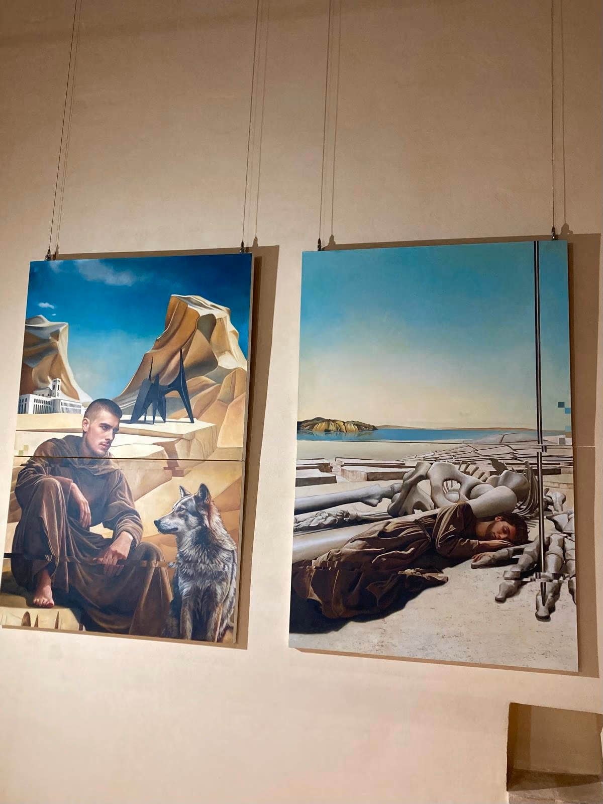 Two large oil works by Giorgio Lupattelli suspended in the display.
